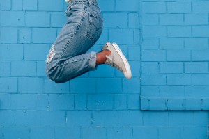 Woman jumping in Converse